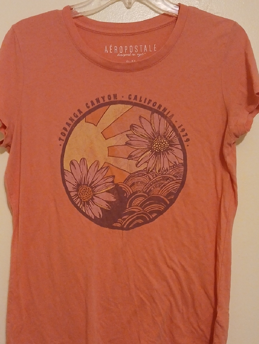 Aeropostale Women's Coral Graphic Tee with Floral Sun Motif